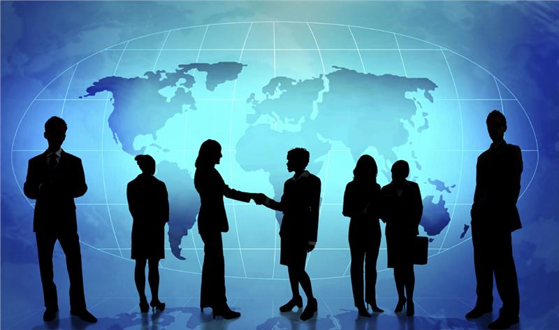 silhouette of business people shaking hands in front of a web-mapping of the world mskproperty typeii 