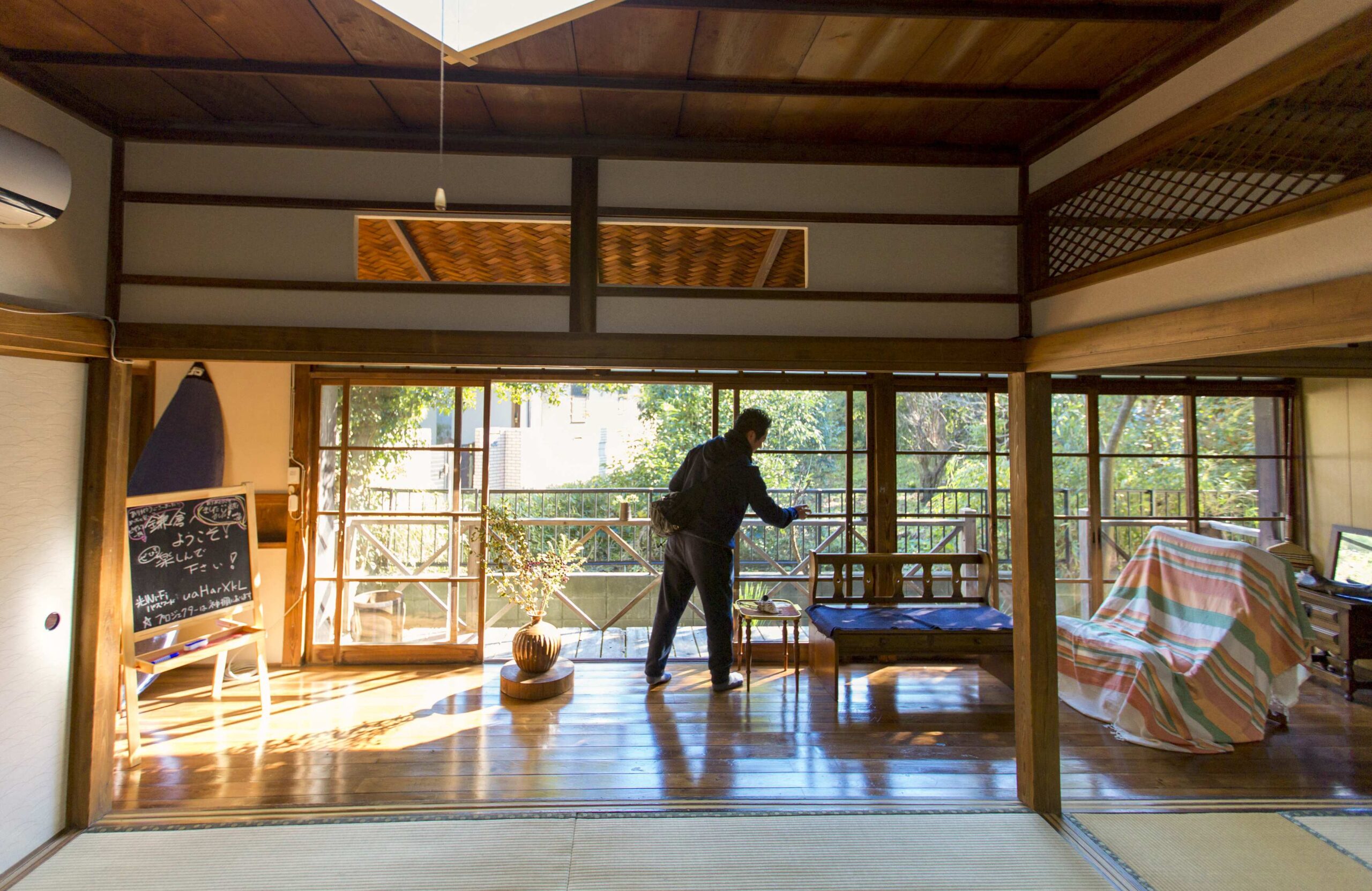 man organizing a beautiful room in a traditional japanese home